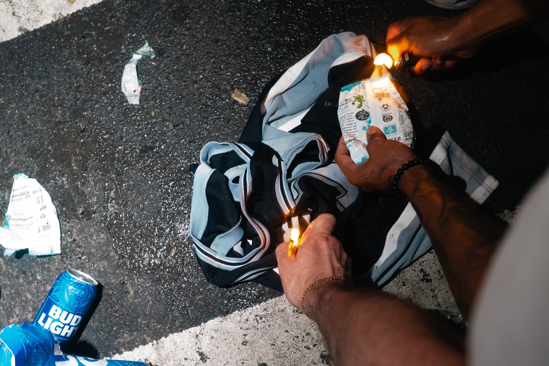 Knicks fans burn jersey during celebrations outside the Garden, photograph 1 of 10