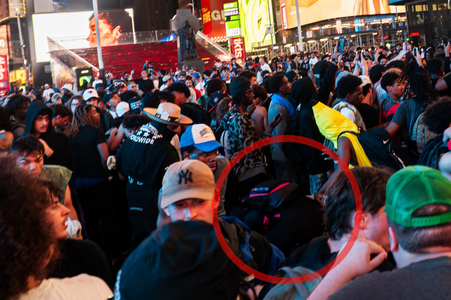 Firework ignites amid Knicks crowd in Times Square, photograph 1 of 10